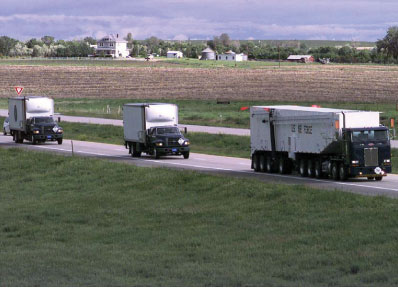 Convoy transporting training missile for emplacement at Delta-09