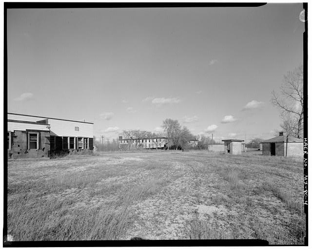 VIEW NORTH, theater, mess ball/administration building, two fuel pump houses